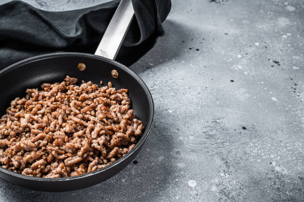 istock Pan fried minced meat to Italian pasta. Gray background. Top view. Copy space 1392282791