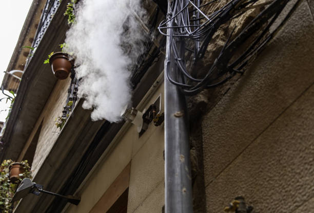 istock Roof with chimney and smoke 1392283093