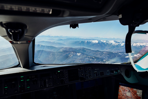 Cockpit view of mountainous terrain