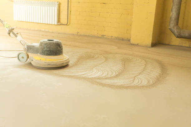 istock A man builder grinds a concrete floor with a sander in a warehouse 1392284481