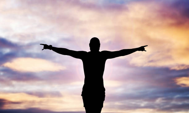 istock Zen meditation background. Sunset man silhouette. 1392288704