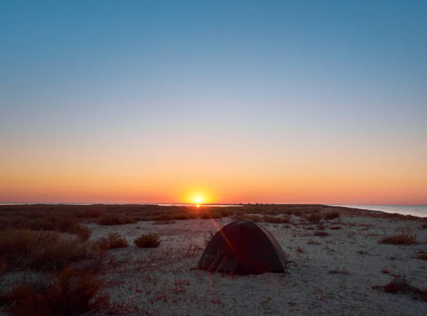 istock Tourist tent on sandy beach. 1392288710