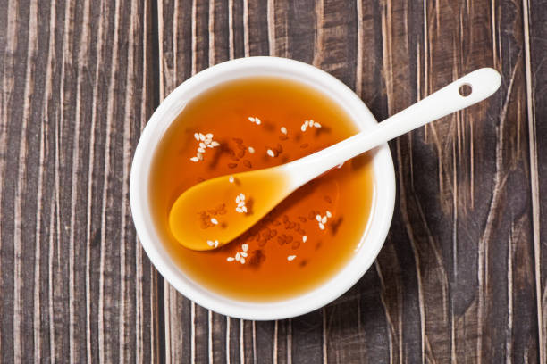 istock Organic sesame Oil in a plate on table 1392288813