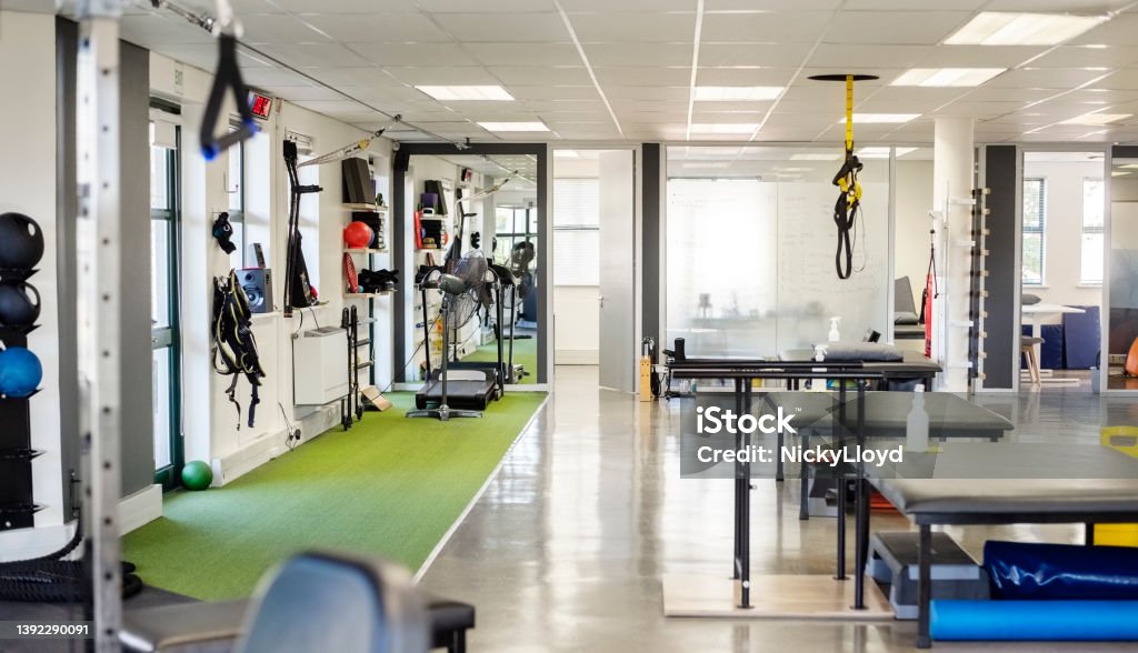 Interior of rehabilitation center with therapeutic equipment Interior of rehabilitation center with different types of therapeutic gym equipment Physical Therapy Stock Photo