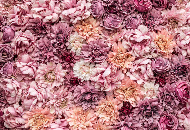 istock Flowers as background. Pink artificial flowers. 1392291780