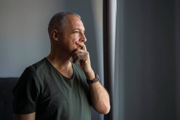 istock Frustrated mature  man with headache at work 1392295103