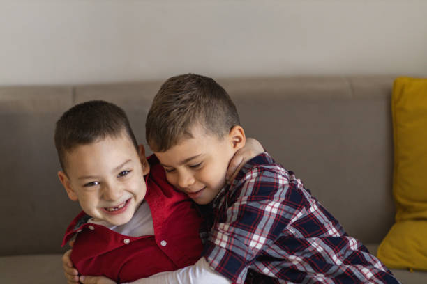 istock Two cheerful little boys hugging 1392295806
