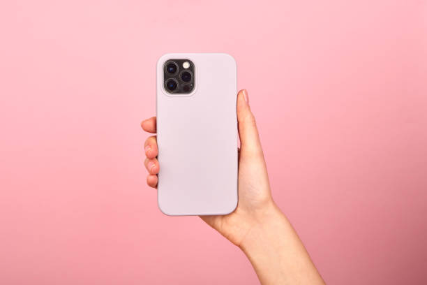 Hands holding a smartphone in a case stock photo