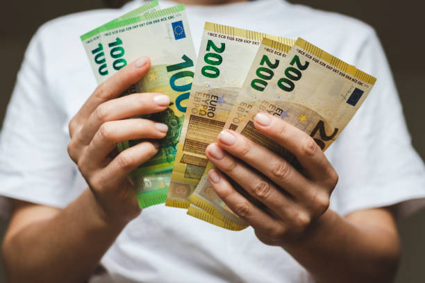 istock Money counting euro notes in hands, saving money. 1392299106