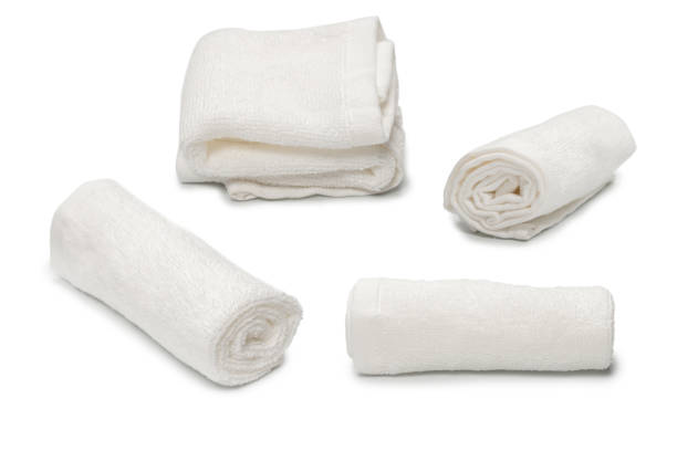 istock White fluffy cotton towel isolated on a white background. 1392302436