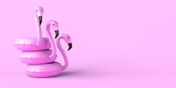 istock Summer concept with flamingo floats on pink background. Copy space. 3D illustration. 1392308326