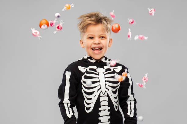 istock boy with candies trick-or-treating on halloween 1392308328