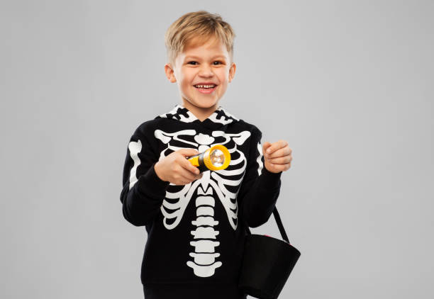 istock happy with candies and flashlight on halloween 1392308342