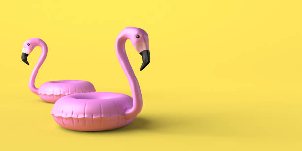 concept d’été avec flotteurs gonflables flamants roses sur fond jaune. espace de copie. illustration 3d. - plastic flamingo photos et images de collection