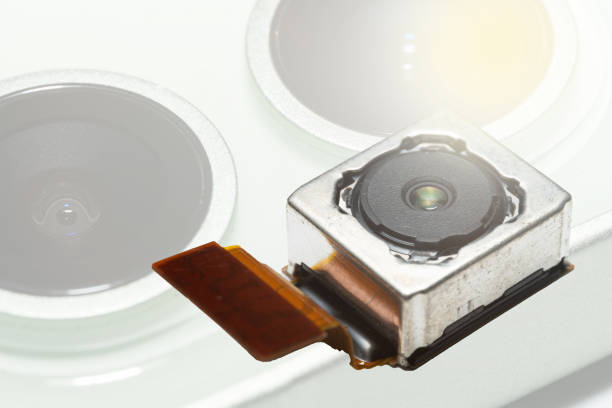 istock camera modules being used in mobile phones. 1392308589