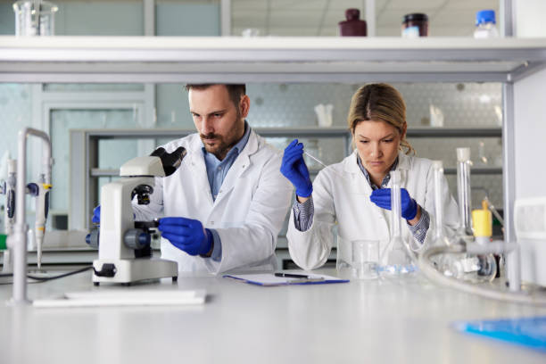 istock Chemists working on medical research in laboratory. 1392311062