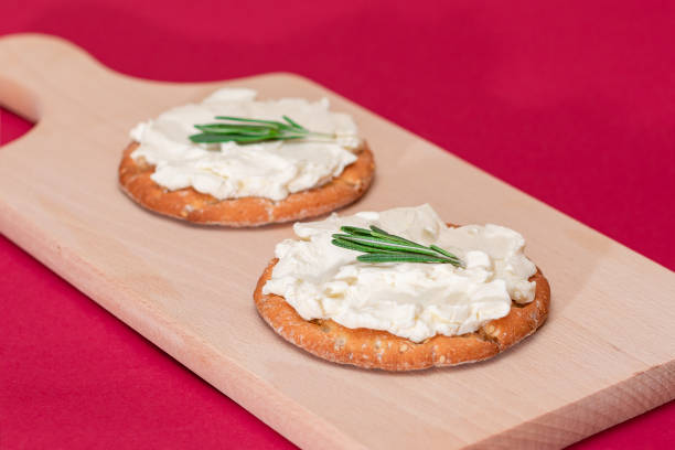 istock Crispy Cracker Sandwich with Cream Cheese and Rosemary 1392311201