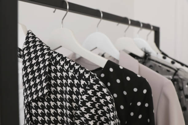 istock Rack with stylish clothes in dressing room 1392311436