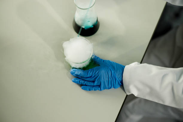 istock Working on green liquid with chemical reaction in laboratory! 1392313053