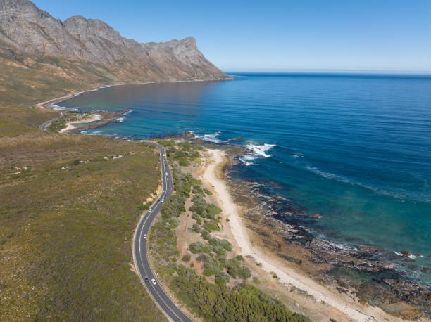 istock Coastal road running along a majestic coastline 1392315486