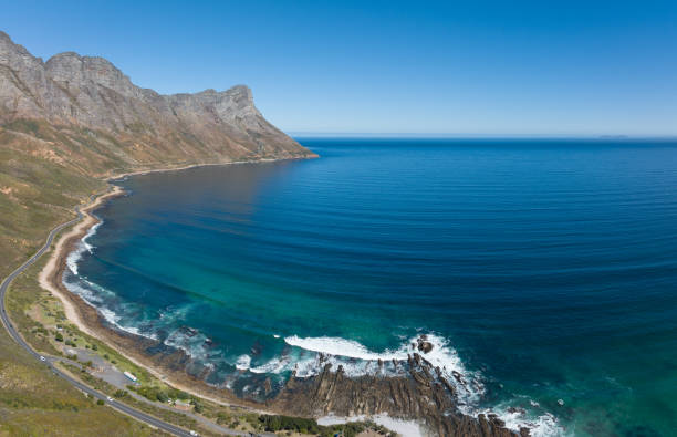 istock Coastal road running along a majestic coastline 1392315643