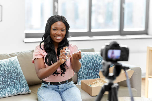 istock female beauty blogger with camera and perfume 1392315683