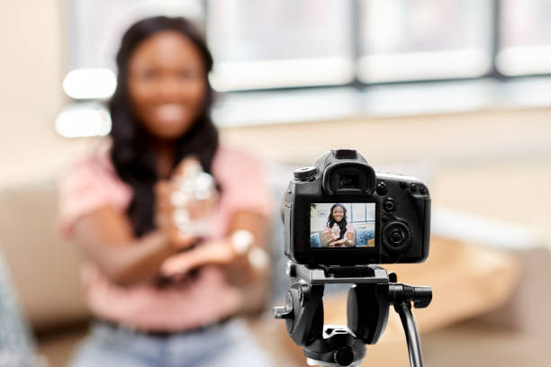 istock female beauty blogger with camera and perfume 1392315815