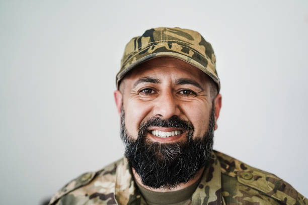 istock Happy male soldier looking at camera - Focus on beard 1392316169