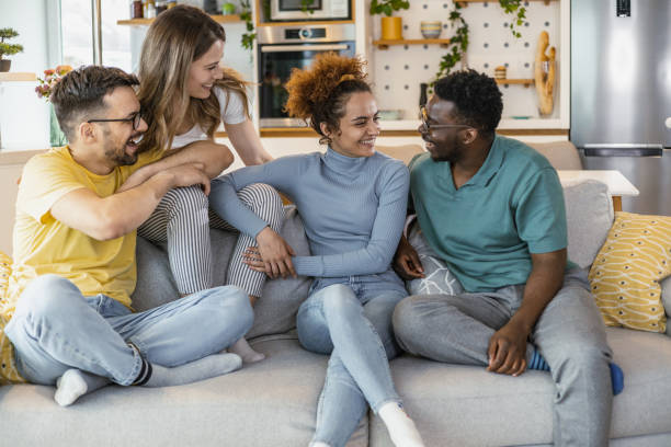 istock Multiethnic group of friends at home 1392318461