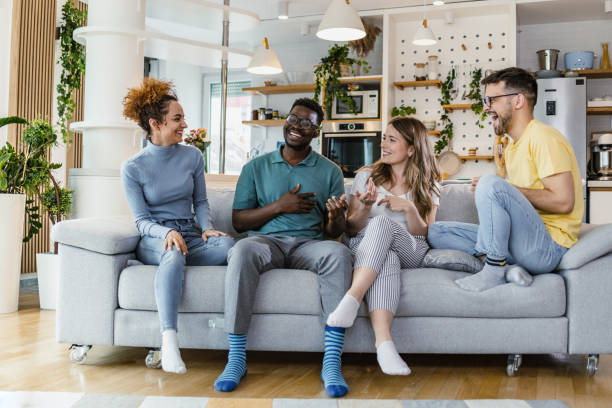 istock Multiethnic group of friends at home 1392318957