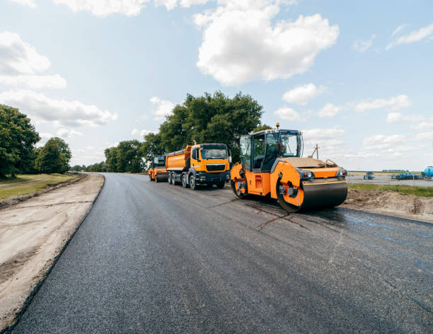 istock Vibratory asphalt roller compactor compacting new asphalt pavement. Road service repairs the highway 1392319177