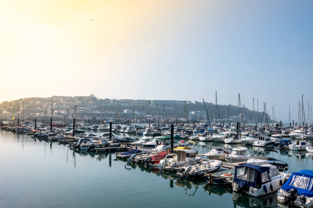 Brixham, UK. Saturday 16 April 2022. Various boats moored in Brixham Harbour Marina