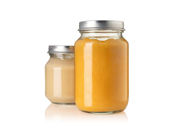 istock Two of baby puree jar isolated on white background 1392321097
