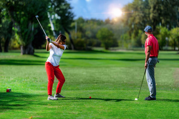 istock Golf vacation for couples, playing golf in a beautiful sunny weather 1392321128