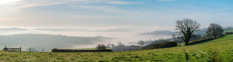 Looking out across the landscape of Dorset, shrouded in the morning mist.