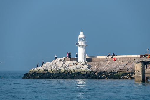 Brixham, UK. Saturday 16 April 2022. People around the Brixham Harbour Lighthouse