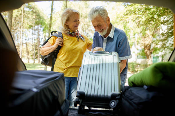 istock Senior couple packing for a road trip 1392321909