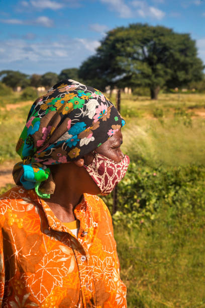 istock African woman with mask 1392322471