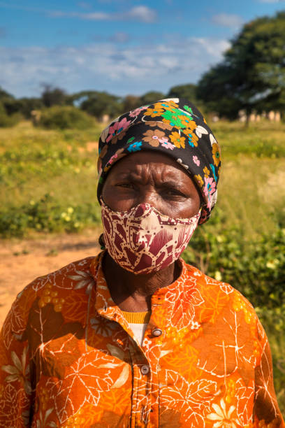 istock African woman with mask 1392323126