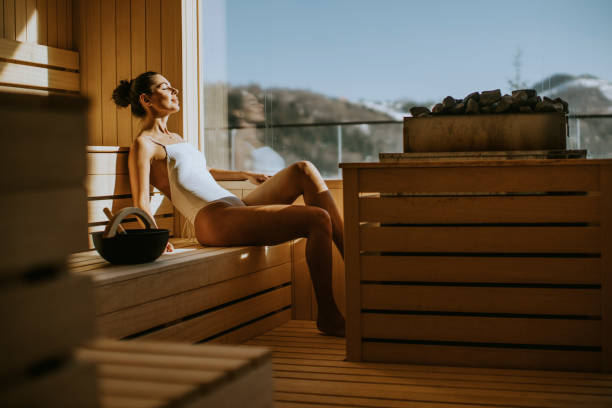 istock Young woman relaxing in the sauna 1392324271