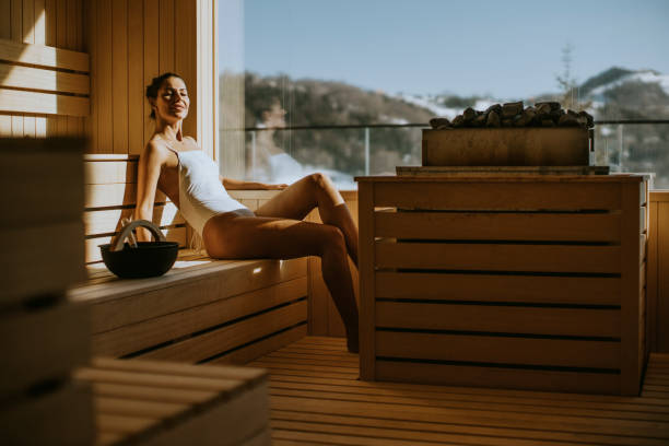 istock Young woman relaxing in the sauna 1392324303