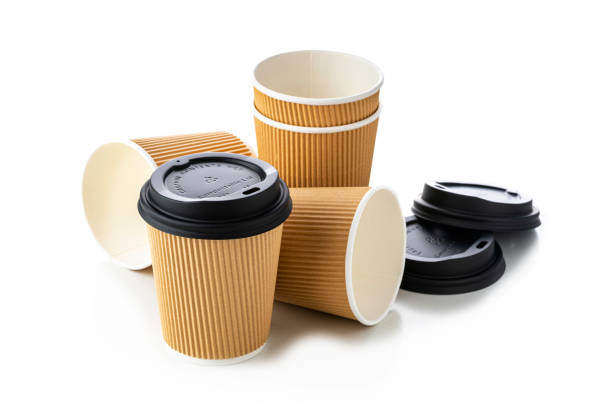 istock Group of disposable coffee cups isolated on white 1392324349