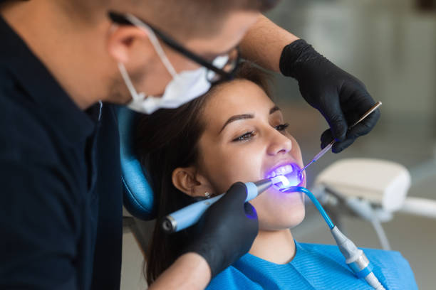 istock Dental treatment with UV lamp 1392326624