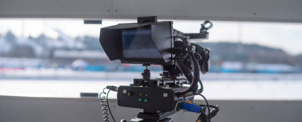 istock tv camera in the ice arena. 1392328146