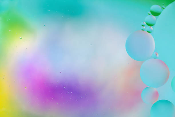 Water in oil in an abstract style on a multicolored gradient background. Surrealism.