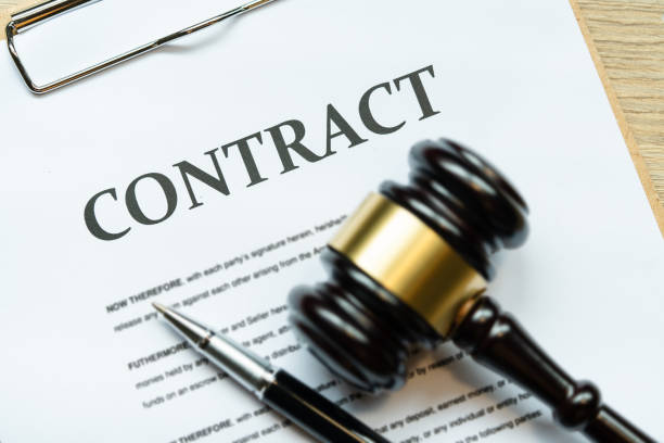 istock wooden judge gavel with signature contract document 1392333145
