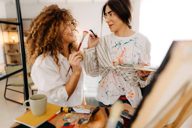 istock Female fine artists drawing in studio 1392333177
