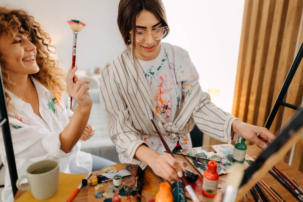 istock Female fine artists drawing in studio 1392333519