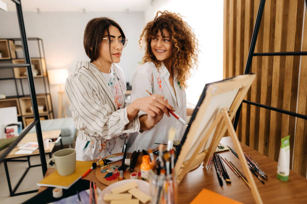 istock Female fine artists drawing in studio 1392333528