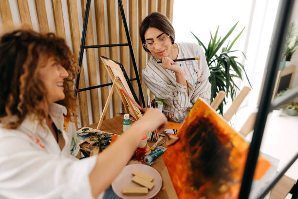 istock Female fine artists drawing in studio 1392333640